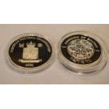 A pair of sterling silver proof-like coins to include Bobby Charlton 1996 and The Queen Mother 50