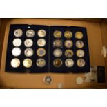 A collection of gold and silver plated coins (approx 28).