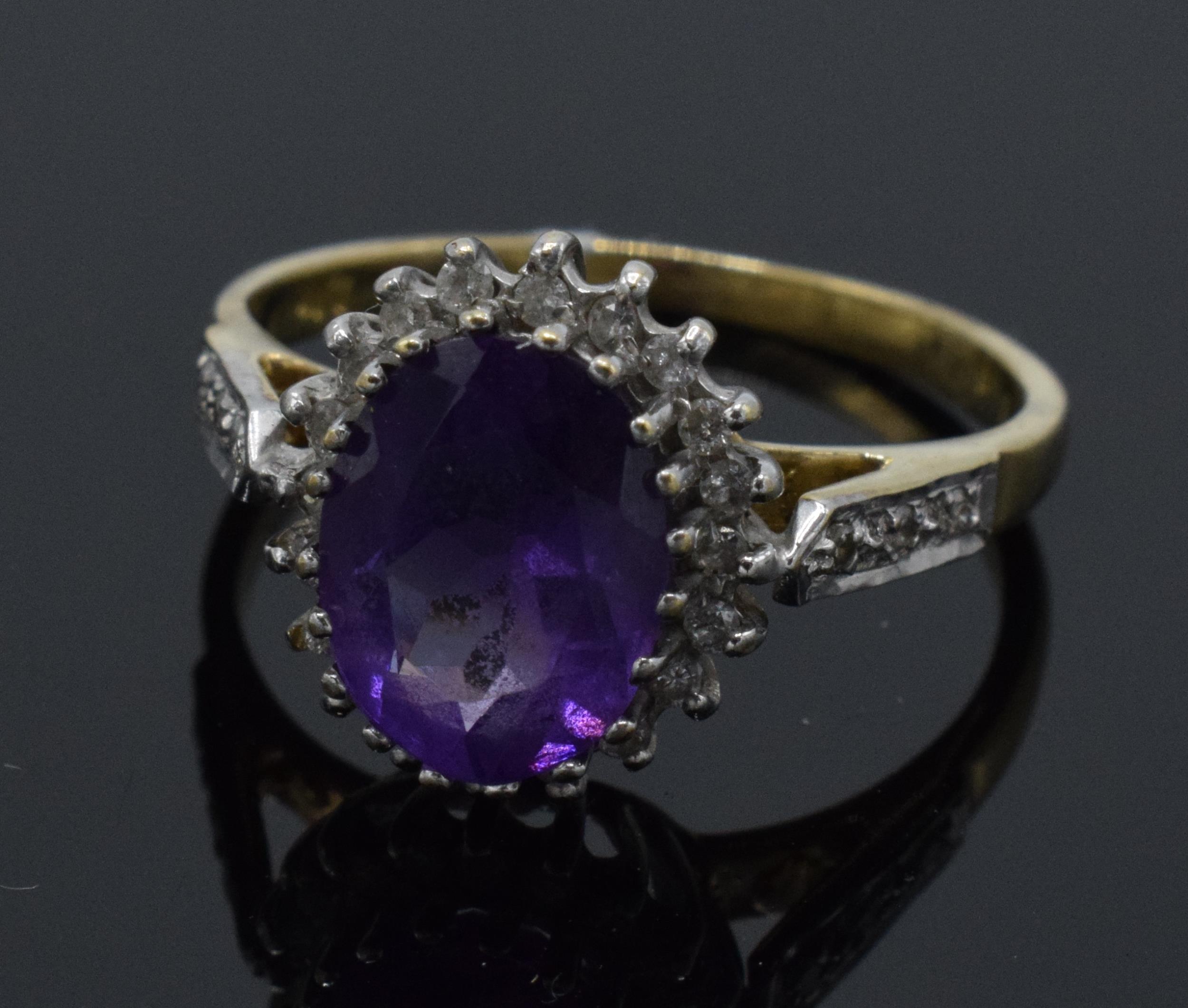 9ct gold amethyst and diamond surround dress ring, 2.6 grams, size M.