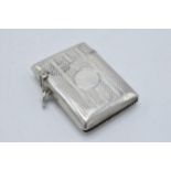 Hallmarked silver vesta case with engineered decoration, Birmingham 1925, 20.9 grams.