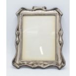 Hallmarked silver scroll-like photoframe, Chester 1899, Colin Hewer Cheshire (missing easel back),