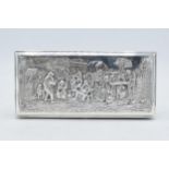 Dutch silver plated cigarette box with repoussé decoration of a tavern scene. 18 x 8cm.