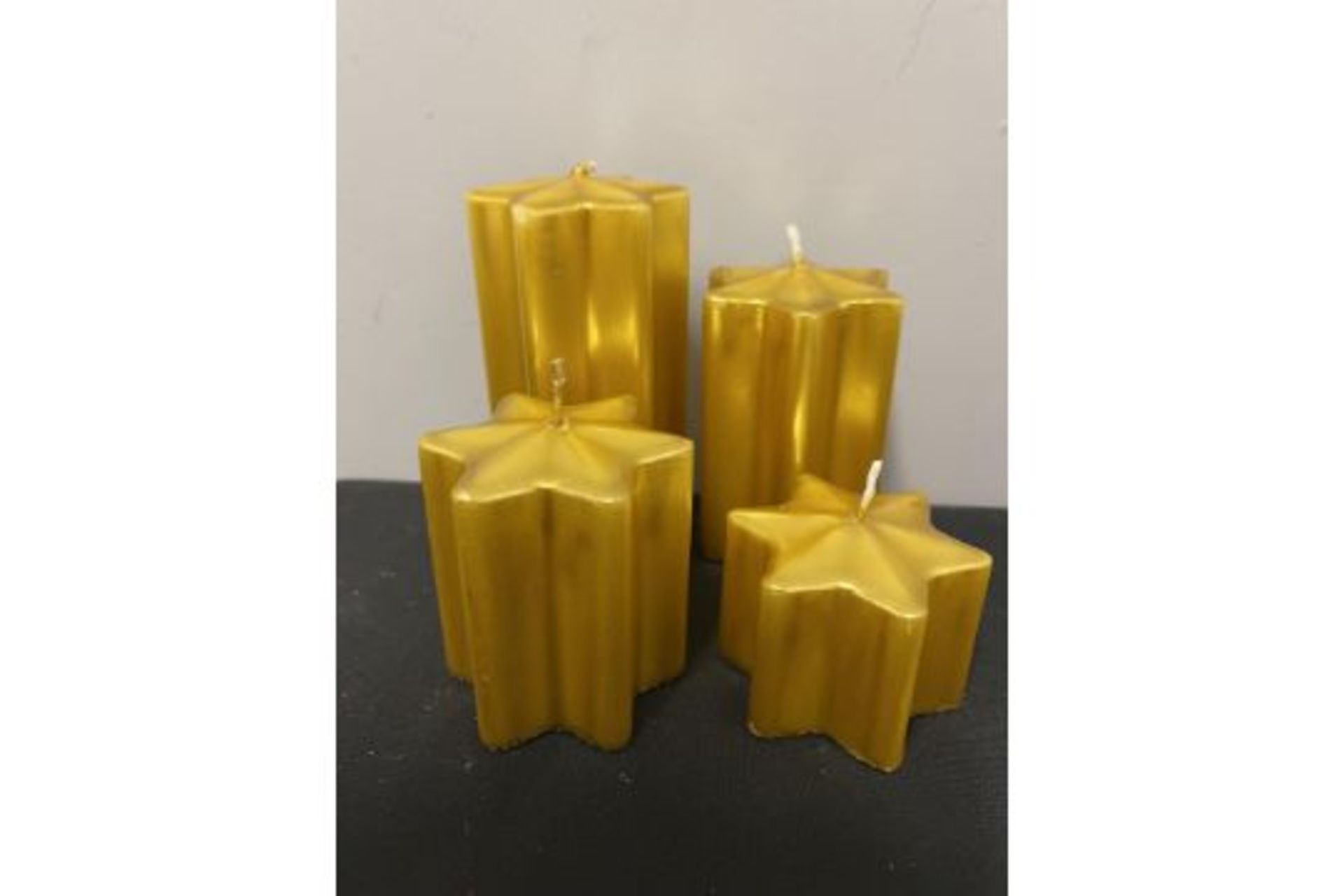 Pack Of 4 Gold Star Candles (various sizes)