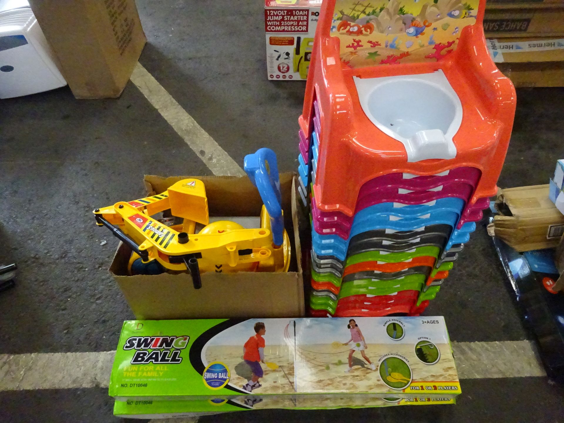 13 CHILDS TOILET TRAINERS, 2 SWING BALLS & CHILDS DIGGER