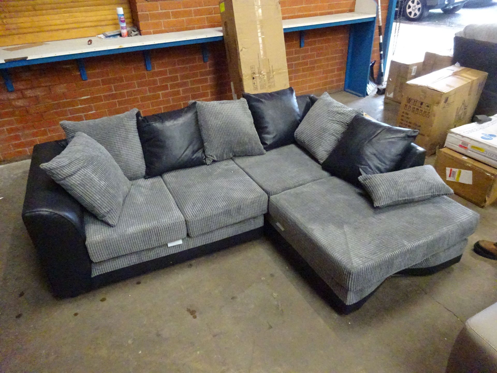 Corner sofa - damage to base see picture - approx 210cm by 160cm black and grey - COLLECTION ONLY