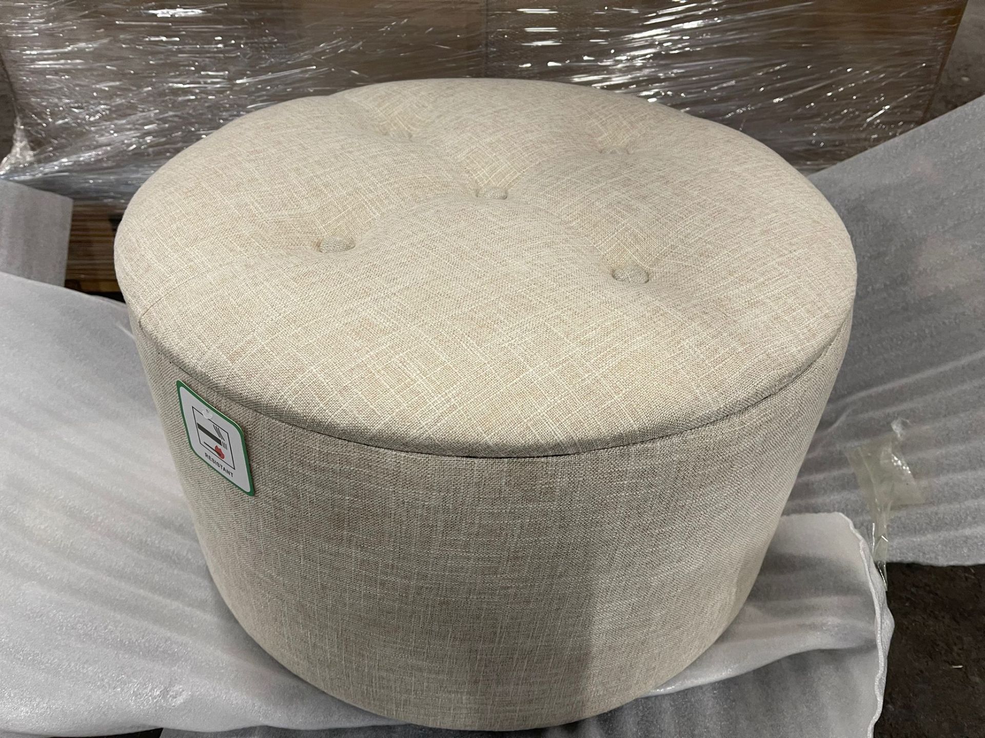 NEW LARGE CREAM ROUND 53CM OTTOMAN WITH STORAGE POCKETS - This round ottoman comes complete with a