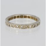 Platinum full eternity ring set with twenty five round brilliant cut diamonds in grain settings,