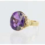 18ct yellow gold dress ring set with single oval amethyst measuring approx. 15mm x 10mm, finger size