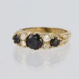 9ct yellow gold sapphire and paste set seven stone ring, finger size K, weight 3.7g