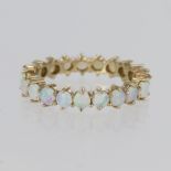 9ct yellow gold full eternity ring set with twenty one 3mm round opal cabochons, finger size R/S,