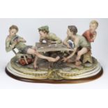 Capodimonte. A large figural display 'The card cheats', depicting a group of children sat around a