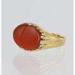 18ct yellow gold signet ring set with an oval cornelian measuring approx. 14mm x 9mm, finger size K,