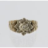 9ct yellow gold cluster ring set with a central round brilliant cut diamond weighing approx. 0.03ct,