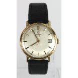 Gents 9ct cased manual wind Omega wristwatch. The cream dial with gilt baton markers and date