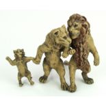 Cold painted bronze depicting a trio of lions walking arm in arm (Mother, Father & Cub). In the