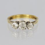 18ct yellow gold trilogy ring set with three round brilliant cut graduated diamonds, centre