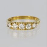 18ct yellow gold five stone graduated carved head ring, set with five round brilliant cut diamonds