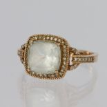 14ct rose gold ring set with a cushion shaped aquamarine measuring approx. 9mm x 9mm surrounded by