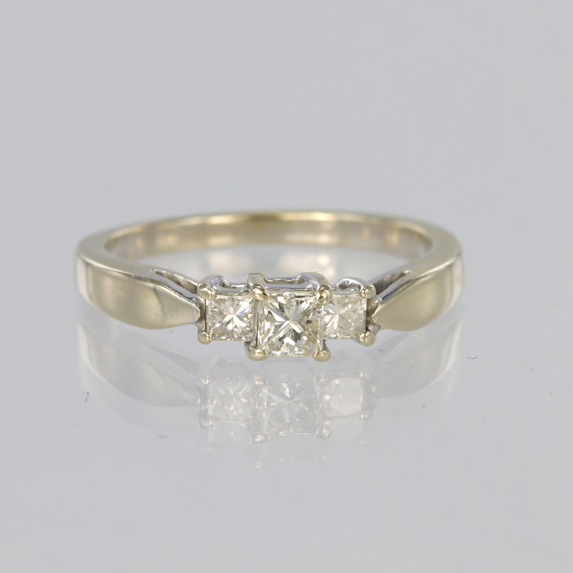18ct white gold trilogy ring set with three graduated princess cut diamonds with a known total