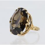 9ct yellow gold dress ring featuring an oval smoky quartz measuring approx. 25mm x 15mm in a crown