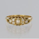 18ct yellow gold boat shaped ring set with three graduated half pearls spaced by four old cut