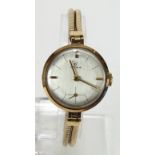 Ladies 9ct cased wristwatch by Cyma on a 9ct bracelet, watch working when catalogued and in its