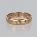 9ct Clogau rose gold band ring with a round brilliant cut diamond weighing approx. 0.01ct set flush,
