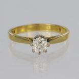 18ct yellow gold solitaire ring set with a single round brilliant cut diamond in an eight claw white