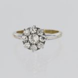 18ct yellow gold cluster ring set with a central round old cut diamond weighing approx. 0.33ct,