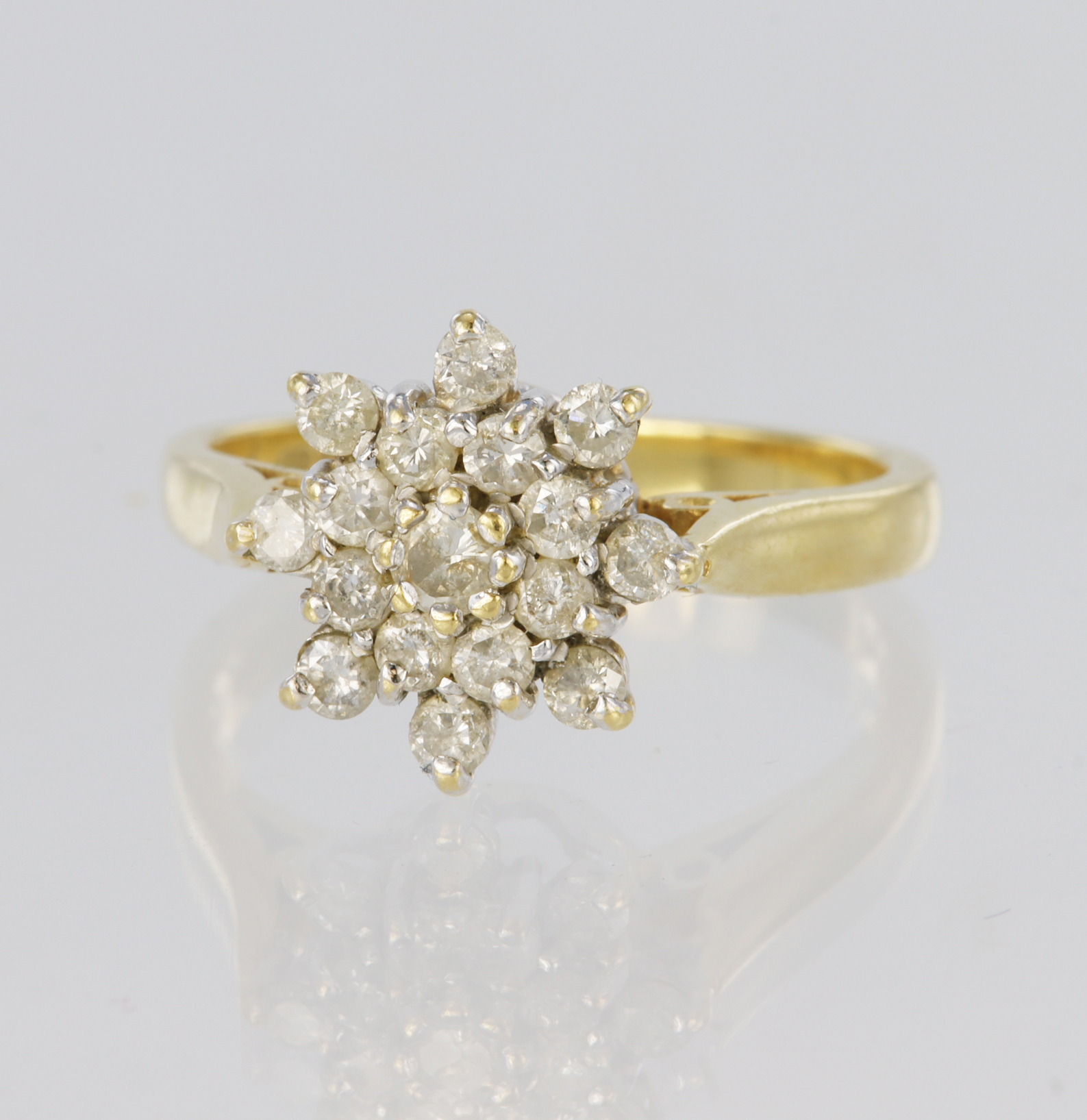 18ct yellow gold three tier cluster ring set with seventeen round brilliant cut diamonds, total