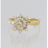 18ct yellow gold three tier cluster ring set with seventeen round brilliant cut diamonds, total