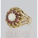 9ct yellow gold dress ring featuring a central round opal cabochon measuring approx. 5.5mm diameter,