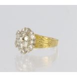 18ct yellow gold three tier cluster ring set with nineteen round brilliant cut diamonds of various