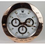 Advertising Wall Clock. Rose gold 'Rolex' style advertising wall clock, white dial reads 'Rolex