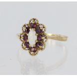 9ct yellow gold ring featuring a marquise shaped opal measuring approx. 8mm x 4mm, surrounded by