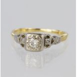 Tests as 18ct yellow gold and platinum solitaire ring set with a single round brilliant cut