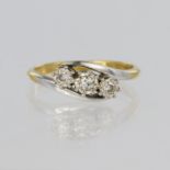 18ct yellow gold crossover style ring set with three round brilliant cut diamonds in 18ct white gold