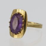 9ct yellow gold dress ring set with an oval amethyst measuring approx. 12mm x 8mm in a raised claw