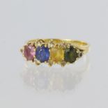 18ct yellow gold ring set with four oval multi coloured sapphires measuring approx. 4mm x 5mm, and
