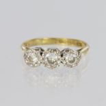 18ct yellow gold trilogy ring set with three graduated round brilliant cut diamonds, centre