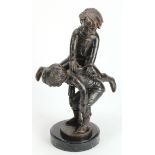 Bronze sculpture depicting children playing leapfrog. Set on a marble base