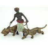 Cold painted bronze depicting a man and two tigers. In the style of Franz Bergman (Viennese). Stamps