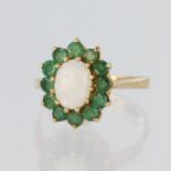 9ct yellow gold cluster ring featuring an oval opal cabochon measuring approx. 8mm x 6mm