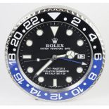 Advertising Wall Clock. Blue, black & chrome 'Rolex' advertising wall clock, black dial reads 'Rolex