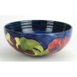 Moorcroft "Hibiscus" bowl on small foot, dark blue. 1st quality. Height 9cm Dia.20cm