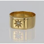 18ct yellow gold band ring measuring approx. 8mm wide set with a single round old cut diamond in a