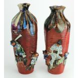 Pair of Japanese Sumida Gawa relief pottery vases. Circa 1900. Each bearing artist's marks.