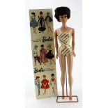 Barbie by Mattel brunette bubble cut doll in swimsuit (no. 850), on stand, contained in original