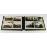 Chinese black lacquer and mother of pearl postcard album, with various postcards inc Hong Kong