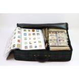 Old suitcase packed with various loose and stuck in cigarette cards, Tea cards and reprint sets.